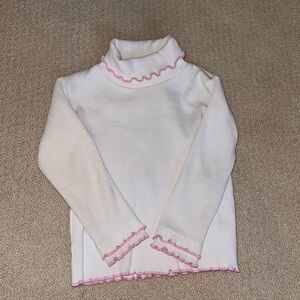 Long sleeve turtleneck with pink ruffles